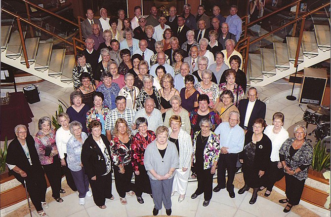 Hawthorn Bank Elite Advantage Club members pose for a photo on the steps of their Alaskan cruise ship before enjoying a private group cocktail party in September.