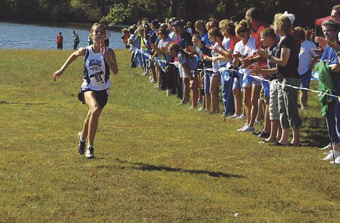 Kaitlyn Shea of the Helias Lady Crusaders heads toward the finish line Saturday at Cole County Park. Shea finished second in the large school girls race at the Helias Cross Country Invitational. 