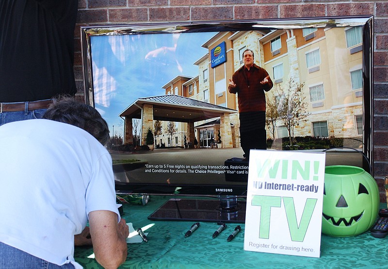 A Kingdom Telephone Co. customer enters a contest to win a high definition Internet-ready television set to be given away during the company's annual open house Friday in Auxvasse. The event promoted a new Skitter television service to by offered by Kingdom Telephone starting early next year.