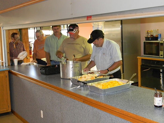 Scrambled cheesy eggs, bacon, sausage, biscuits and gravy were served  along with drinks at the Men of Integrity Men's Breakfast.