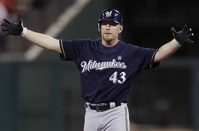 Milwaukee Brewers' Randy Wolf reacts after hitting a double during the third inning of Game 4 of baseball's National League championship series against the St. Louis Cardinals Thursday, Oct. 13, 2011, in St. Louis. 