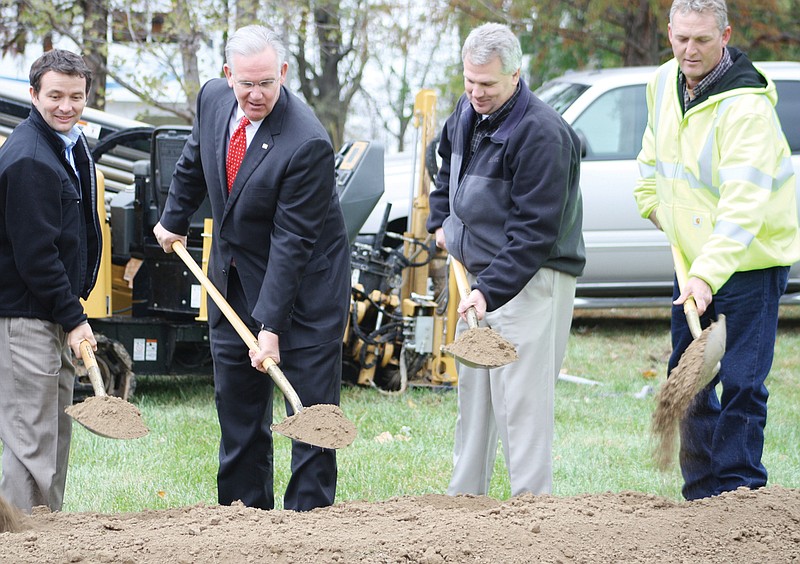 Missouri Gov. Jay Nixon, second from left, joins a groundbreaking ceremony Wednesday outside the Millersburg Christian Church for the start of Socket Telecom's construction of a fiber optic broadband network in Callaway County. With the governor, from left, are Joe Ridenhour of Ridenhour Construction Co. of Jefferson City; George Pfenenger, Socket chief executive officer; and Carson Coffman, Socket president.