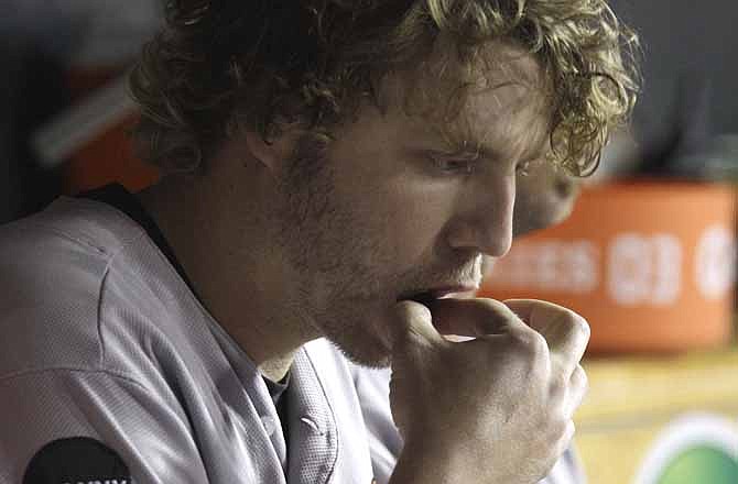 In this Sept. 22, 2011 file photo, Baltimore Orioles third baseman Mark Reynolds chews tobacco during the sixth inning of a baseball game against the Detroit Tigers in Detroit. Four U.S. senators and health officials from the cities hosting the World Series are urging the baseball players union to agree to a ban on chewing tobacco at games and on camera. 