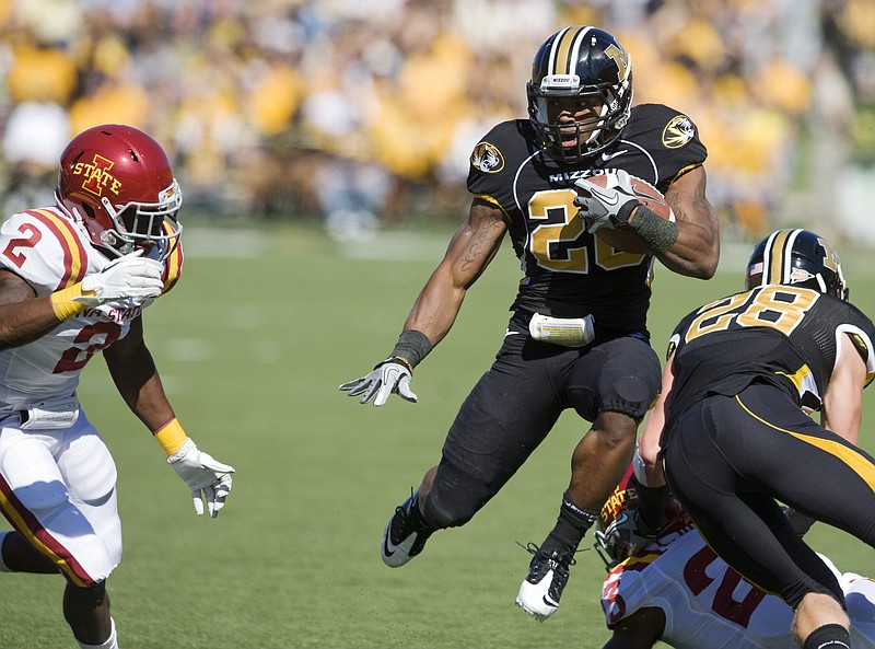 Missouri running back Henry Josey leaps in the air as he tries to get past Jansen Watson of Iowa State during Saturday afternoon's game at Faurot Field.