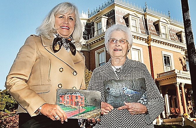 Cyndy Carder and her mother, Billie Shanks, pose with the roof tiles they received courtesy of Missouri Mansion Preservation. The women lost their original hand-painted tiles when their Joplin homes were destroyed in the May 22 tornado.