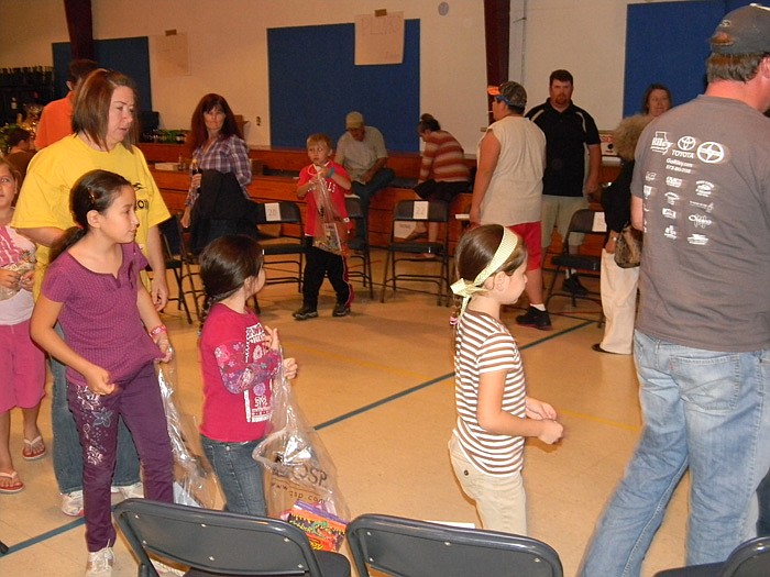 Young and old alike enjoy the "Cake Walk" game at the High Point School Carnival held Saturday, Oct. 22. The school has the annual fundraiser to meet the needs of the school.