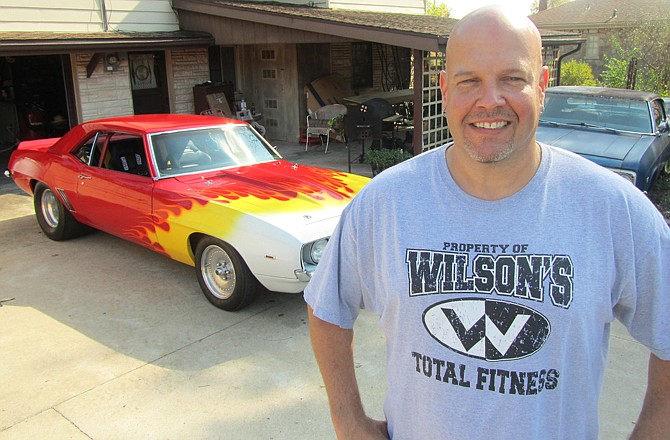 Ed Neeley poses with his 1969 Chevy Camaro. It was his first car, which he kept until it was stolen in 1995. He recently stumbled across his prized sports car when he found it for sale online, and won a battle to get it back.