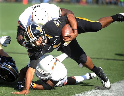 Missouri quarterback James Franklin hits the ground during Saturday's game against Oklahoma State at Faurot Field.