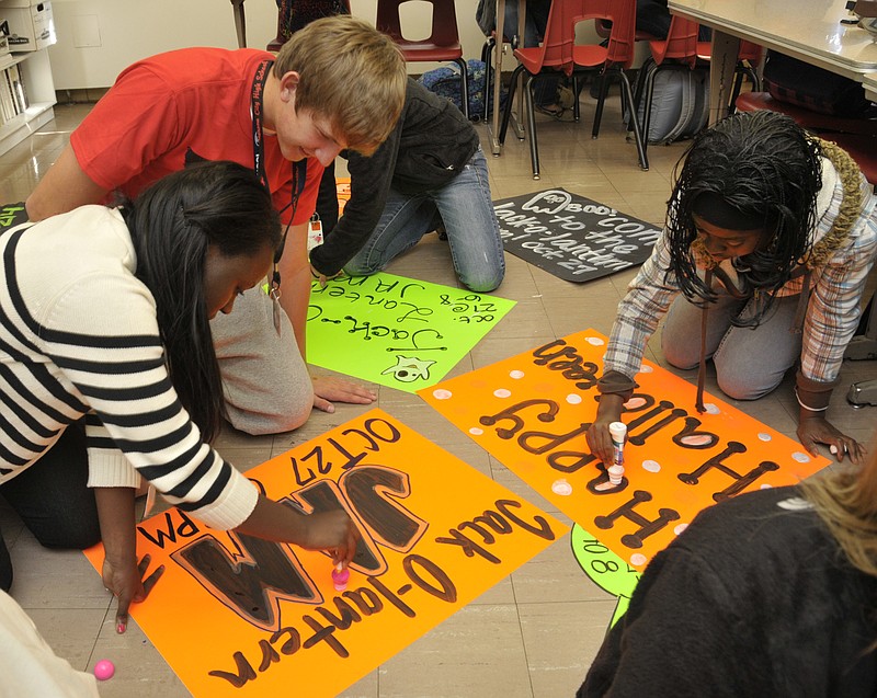 
Students in the Jefferson City High School leadership class make Halloween posters during their meeting.