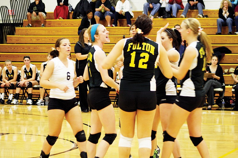 The Fulton Lady Hornets volleyball team celebrates after scoring a point in its 25-14, 25-16 win over No. 3 seed Kirksville in the Class 3, District 9 semifinals Wednesday night at Roger D. Davis Gymnasium. No. 2 Fulton went on to claim its third straight District 9 title with a 25-17, 23-25 and 25-23 victory over top-seeded Boonville in the championship match later Wednesday night.