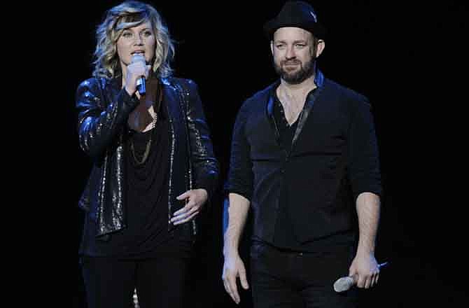 The American country music duo Sugarland featuring vocalist Jennifer Nettles, left, and guitarist Kristian Bush speak to the crowd before a benefit concert in Indianapolis, Friday, Oct. 28, 2011. Seven people were killed and dozens more were injured in the Aug. 13 stage collapse at the Indiana State fairground venue where high winds ahead of an approaching storm toppled scaffolding and stage rigging just minutes before Sugarland was to perform. 