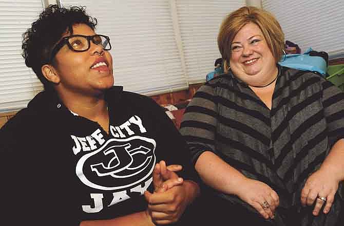 BriAnna Boney, left, and her Transitions program mentor Mindy Ulstad, right, talk about the close bond the two have formed during an interview at the Central Missouri Foster Care and Adoption Resource Center in Jefferson City on Thursday.