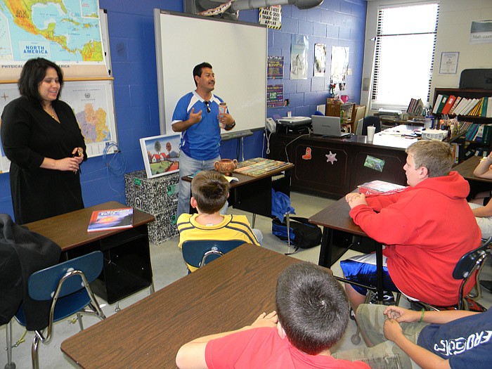 David Ayala, pastor of First Baptist Church, San Vicente, El Salvador,  gives a presentation through interpreter Roxy Antonio to Terre Chambers' Spanish class Tuesday, Oct. 25, during his visit to High Point.