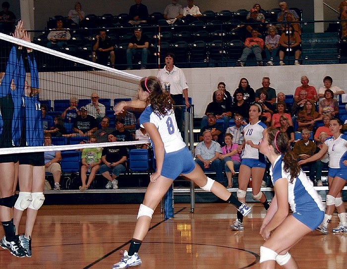 California's Karin Bolinger (8) executes a successful kill during the semifinal match against Cole Camp Oct. 25.