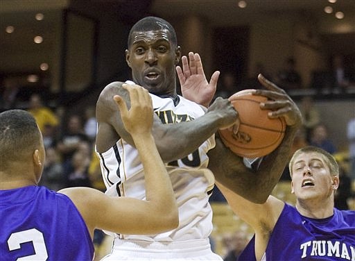 Missouri forward Ricardo Ratliffe pulls down a rebound between two Truman State players during Wednesday's exhibition game at Mizzou Arena.