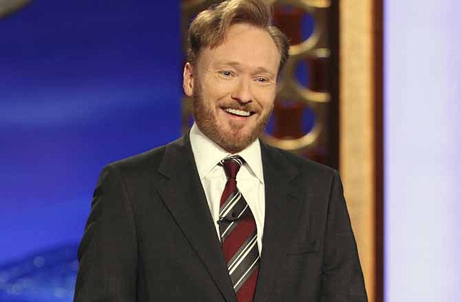 In this publicity image released by Team Coco, Conan O'Brien, host of the new "Conan" show on TBS speaks during his monologue, Tuesday, Nov. 9, 2010. With Election Day 2012 looming a year away, Republicans trying to unseat President Obama are getting lampooned by late-night TV comics. 