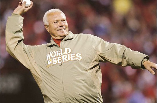 Bob Forsch throws out the ceremonial first pitch prior to Game 7 of the World Series between the Cardinals and Rangers last Friday at Busch Stadium.