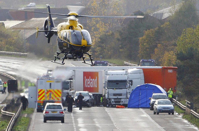 Authorities investigate the scene of a deadly accident early Saturday on the M5 motorway in southwestern England. The late Friday accident killed 7 people and involved 27 vehicles. Witnesses said smoke from a Guy Fawkes fireworks celebration may have caused the pileup.