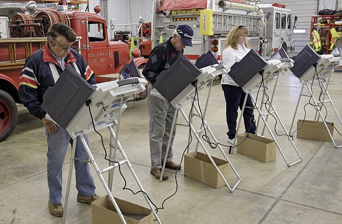 Voters cast their ballots Tuesday at the Wakeman Township fire station near Wakeman, Ohio.
