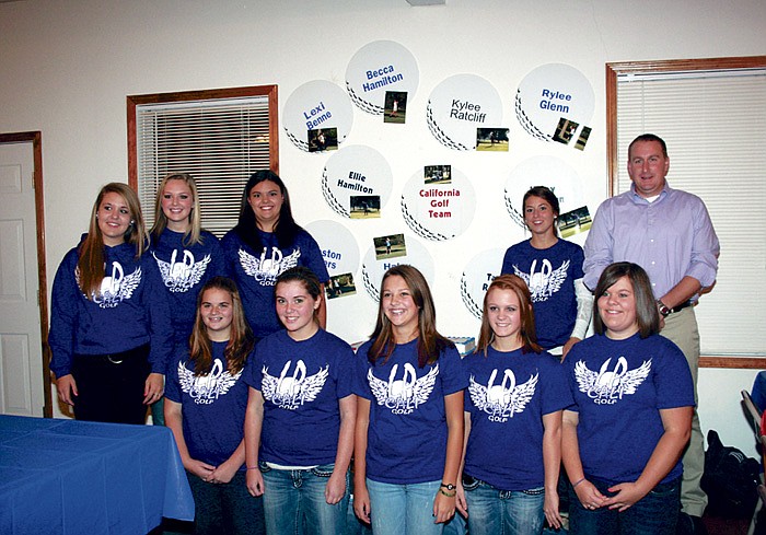 Lady Pinto golfers and Coach Lance Conner gather for a final team picture.