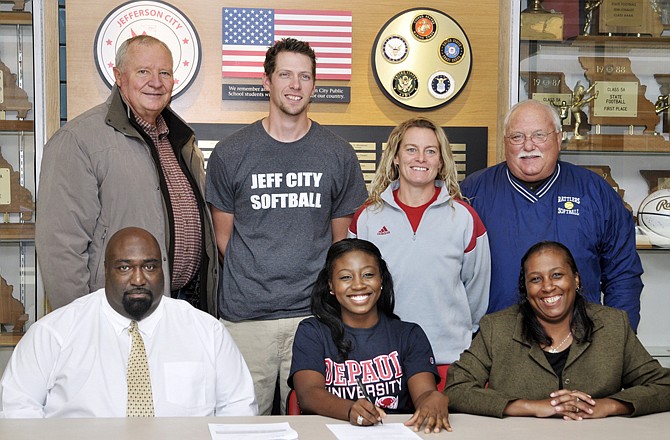 Marsha Pendilton (seated, center) of Jefferson City High School signed a letter of intent Thursday to play softball at DePaul University. Also seated are her parents, John Ginwright and Yolanda Calvin. Standing (from left) are Rattlers coach Steve Hirt, Jefferson City assistant coach Zach Miller, Jefferson City head coach Lisa Dey and Rattlers coach Gary Ennis.