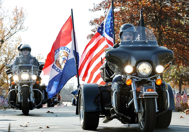 Missouri National Guard Sgt. Maj. Gary Blackerby of the American Legion Riders leads the group through the cemetery as part of the exit procession. They were part of ceremony at Riverview Cemetery Friday morning.