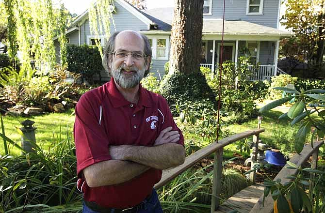 In this Nov. 3, 2011 photo, Denny Johnston poses for a photo at his home in Olympia, Wash. When Johnston retired from the Washington state corrections system, he was able to convert $15,000 of unused sick time into a tax-free account to pay health-care expenses. 
