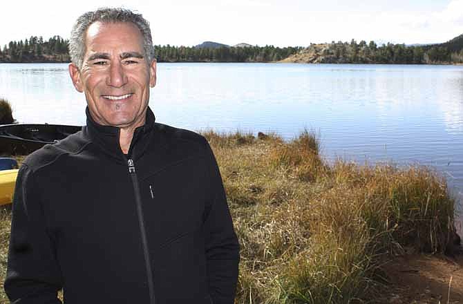 In this Tuesday, Oct. 25, 2011 photo, Joseph DeNucci, a founder of the Insight Intensive retreat, stands on the shores of Gold Lake, Colo., a private lake in the mountains west of Boulder. DeNucci bought the land and buildings and converted it into a program for young men who suffer from what some call "failure to launch." 