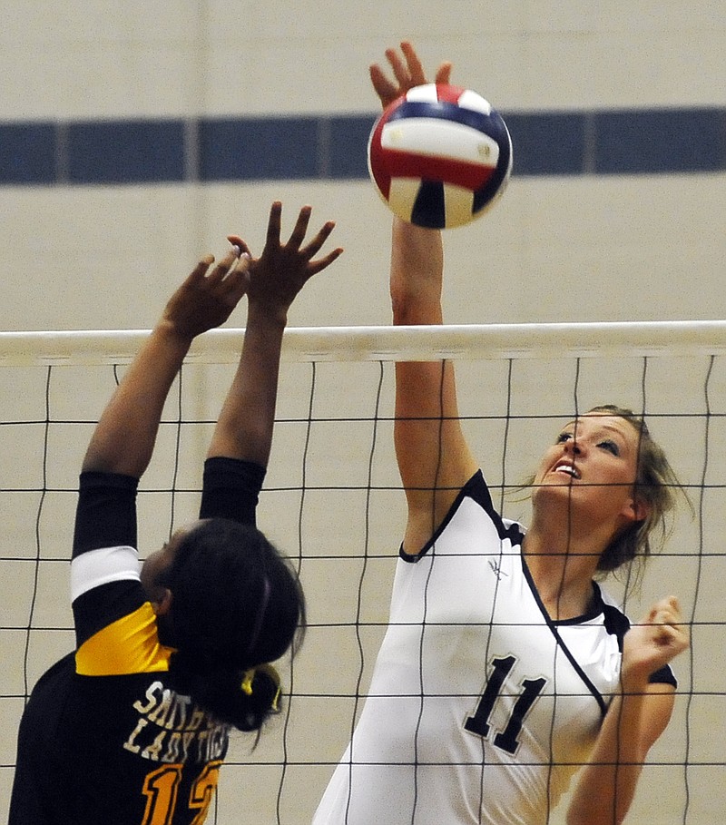 Helias senior Krista Haslag goes up for a kill during a match this season. Haslag was a first-team selection in Class 4. 