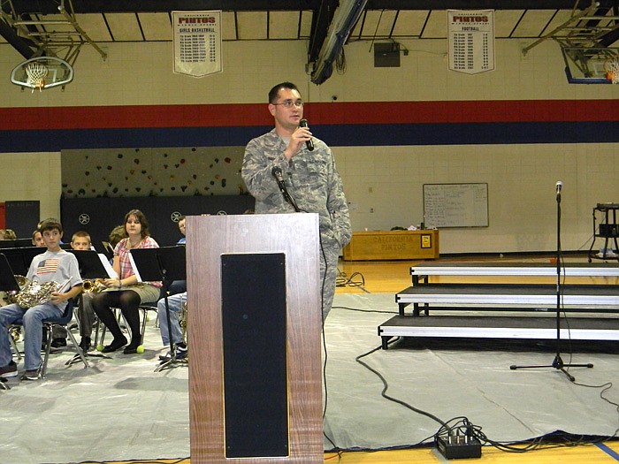 Retired Air Force Tech Sergeant Brian Boguski speaks during the assembly.