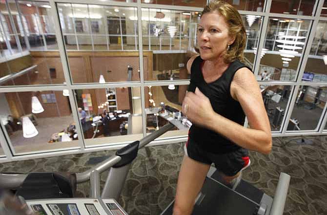 In this Nov. 1, 2011, photo Sandy Morgan, 57, works out in a gym in Midlothian, Va. Most people don't want to think about death, much less plan for it, especially when they feel healthy and young in their middle-age years. And that, some baby boomers say, is one of the big reasons so few of them have end-of-life legal documents such as a living will. 