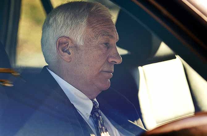 In this Nov. 5, 2011 file photo, former Penn State football defensive coordinator Gerald "Jerry" Sandusky sits in a car as he leaves the office of Centre County Magisterial District Judge Leslie A. Dutchcot in State College, Pa. Sandusky, who is charged with sexually abusing eight boys in a scandal that has rocked the university, said in an telephone interview with Bob Costas Monday night on NBC News' "Rock Center" that there was no abuse and that any activities in a campus shower with a boy were just horseplay, not molestation. (AP Photo/The Patriot-News, Andy Colwell, File)