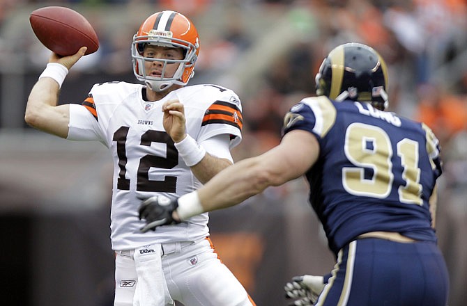 Rams defensive end Chris Long closes in on Browns quarterback Colt McCoy during the first quarter of Sunday's game in Cleveland.