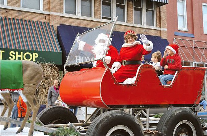 Santa Claus, Mrs. Claus and their elves waved Saturday to parade-goers during the annual Eldon Christmas Parade in downtown Eldon. Santa and his entourage were pulled by their eight "lighted" reindeer aboard a long-bed trailer and had a fun day visiting with children and families who attended the Christmas Festival and Parade.