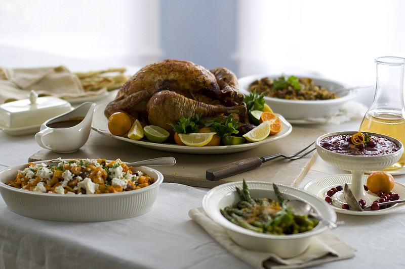 Shown here is a citrus turkey surrounded by side dishes. No need for a salt shaker on the Thanksgiving table: Unless you really cooked from scratch, there's lots of sodium already hidden in all the turkey and trimmings.