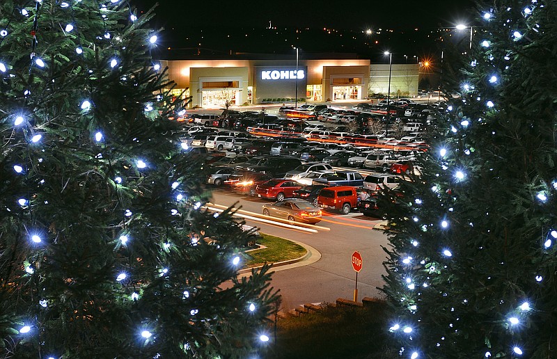 Lights streak up and down the aisles of the Jefferson City Kohl's parking lot as early bird Black Friday bargain hunters search for parking spots more than an hour after the store's midnight opening on Thursday night.