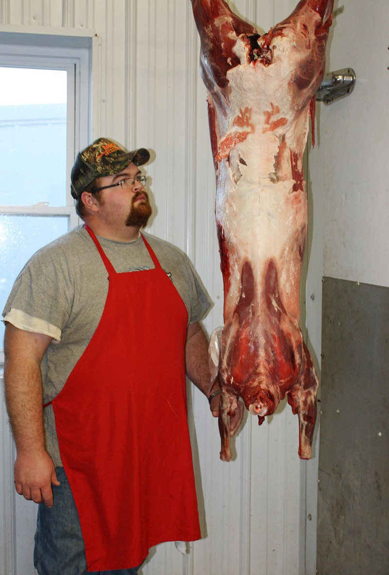 2011 FILE: Dustin Horn of Horn's Butcher and Meat Processing, 3345 County Road 318 Fulton, prepares to process a deer. 