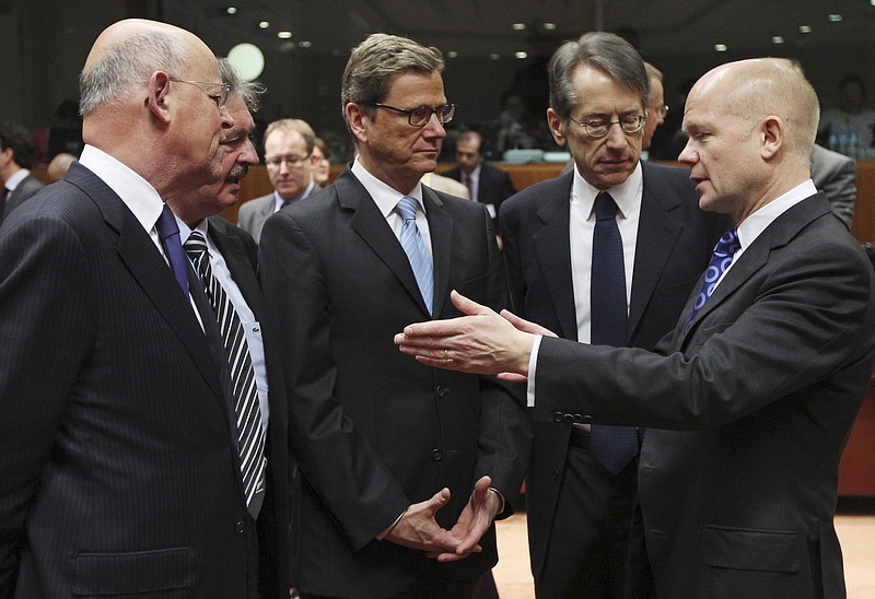 British Foreign Secretary William Hague (right) speaks to (from left) Dutch Foreign Minister Uri Rosenthal, Luxembourg's Foreign Minister Jean Asselborn, German Foreign Minister Guido Westerwelle and Italy's Foreign Minister Giulio Terzi di Sant' Agata prior to the start of an EU foreign ministers meeting Thursday in Brussels.