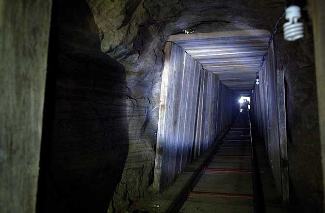 View from inside a tunnel recently found in the northern border city of Tijuana, Mexico, Wednesday Nov. 30, 2011. A day earlier, the tunnel was discovered by U.S. authorities in San Diego's Otay Mesa area, the latest in a spate of secret passages found to smuggle drugs from Mexico. This tunnel is a 600-yard passage linking warehouses in San Diego and Tijuana and is equipped with lighting and ventilation. 