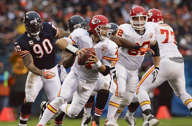 Chiefs quarterback Tyler Palko tries to escape from pressure during Sunday's game with the Bears in Chicago.