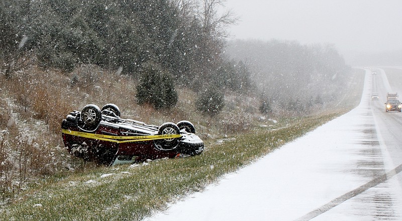 In the first snow of the season, a motorist slipped off the road and overturned Tuesday morning eight miles south of Fulton on the eastbound lane of U.S. 54. 