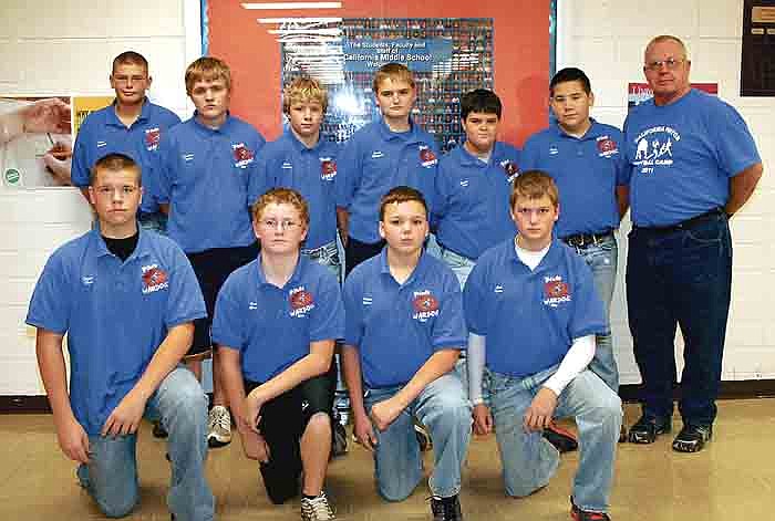 First-year California Middle School War Dogs who were recognized at the CMS Football Banquet Nov. 28, front row, from left, are eighth graders Taylor Hampton, Nick Green, Logan Sperry and Matthew Brown; back row, seventh graders Dustin Ferguson, Johnathan Walker, Rick Worthey, Grant Hofstetter, Hunter Hess and Bryce Miller. At far right is CMS Football Coach Ed Ziegs.