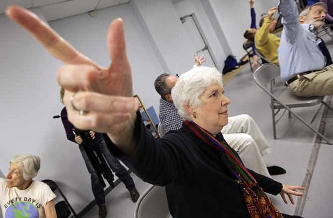 Rosyln Lieb, center, works on during a dance class therapy for Parkinson's at the Hubbard Street Dance Center on Saturday, Nov. 5, 2011 in Chicago.