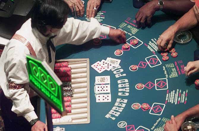 In this August 1999 file photo, poker is played at Station Casino in Kansas City, Mo.