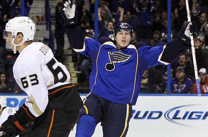 St. Louis Blues' Ian Cole, right, celebrates after scoring as Anaheim Ducks' Nick Bonino, left, skates past during the second period of an NHL hockey game, Thursday, Dec. 8, 2011, in St. Louis. 