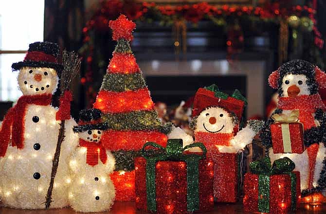 A festive collection greets holiday visitors to the Walker residence Tuesday morning at 5517 Bradford Court in Taos. It will be part of the Heisinger Auxiliary Homes Tour from 1 to 5 p.m. Sunday.