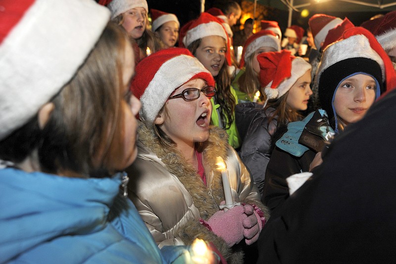 The North School Notables serenade the crowd with a Christmas carol medley just before the Holts Summit Christmas Tree Lighting Thursday evening, at Hibernia Station Park. This is the first year for the ceremony which officials said they hope to make an annual event.
