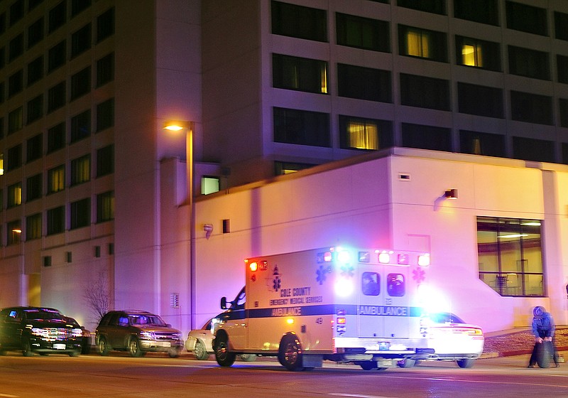 Police and ambulance personnel respond on Dec. 10, 2011, to Capitol Plaza Hotel in Jefferson City where a suspect in a Dent County double homicide was shot and apprehended by law enforcement. (News Tribune photo)