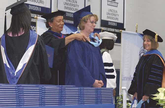 Jill Struemph is presented with her Masters Degree in Education Specialist for Elementary Education by University President Dr. Carolyn R. Mahoney at the December Commencement Ceremony at Lincoln University on Saturday.