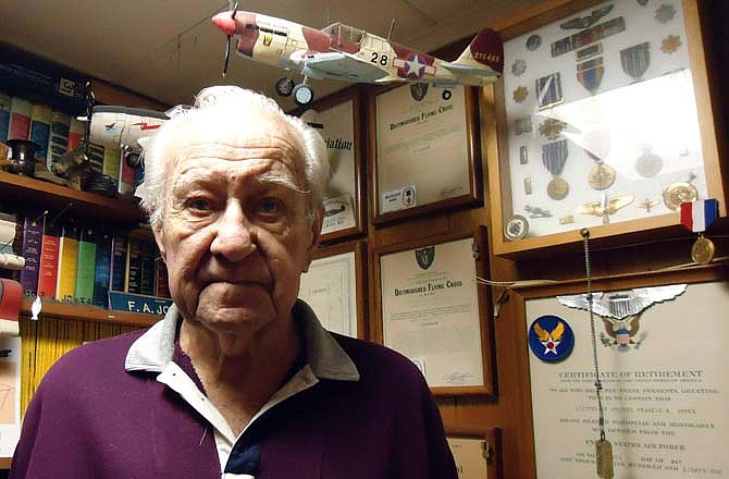 Standing in his "Air Corps Corner," local veteran Bud Jones shared his story of flying 117 combat missions on P-40 Warhawks and P-47 Thunderbolts during World War II.